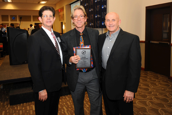 Men’s Soccer Coach Cliff Brown, with Athletics Director Vic Trilli, left, and former Newman Baseball Coach and Hall of Famer Paul Sanagorski, was honored for 25 years coaching at Newman University.