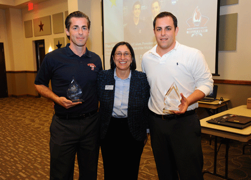Newman President Noreen M. Carrocci, Ph.D. with Dan Giroux ’96, left, and Zack Steven, recipients of the 2013 Thomasine Stoecklein, ASC Spirit Award.