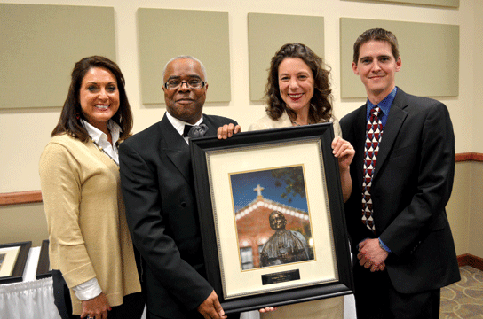Gregory Cole ’95, second from left, received the Leon A. McNeill Distinguished Alumni Award at the banquet. With Cole are, l-r: Newman Director of Alumni Relations Sarah (Kriwiel) Cundiff ’86, ‘90; Julia Fabris McBride, who presented the award to Cole, and Alumni Association President Anthony Tamburro ’03, ’07.