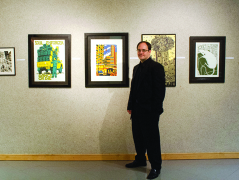 Sonny Laracuente ’12 with prints from his Senior Show 