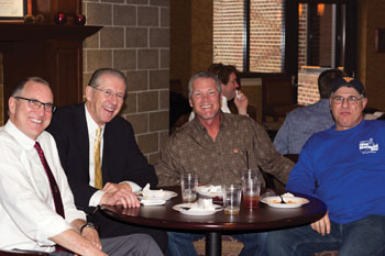 Alumni basketball players enjoying lunch with former Men’s Basketball Coach Dave Skinner, second from left, included, l-r: Bill Powers ‘78, Mark Ondich ’79 and JoJo Covington ‘80.