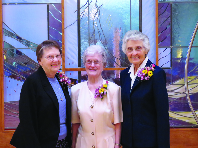 L-r: ’63 Maureen Farrar, ASC, ’54, ’62 Marita Rother, ASC and ’53, ’62 Catherine Shippen, ASC celebrated 60 years of service as Adorers on May 3, 2015. The women made their first vows July 1, 1955 and final vows five years later. Sister Maureen later worked in public relations at SHC. Sister Marita served as assistant director and director of the Elementary Education Department at Kansas Newman College. Sister Catherine was an Admissions Office receptionist at Newman University.