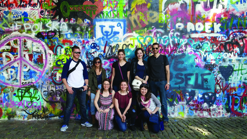 Students at the John Lennon Wall in Prague