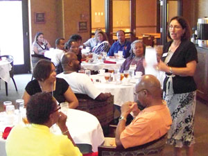 Newman University President Noreen M. Carrocci, Ph.D. talks with African-American Alumni