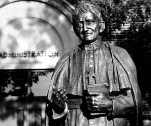 Cardinal Newman statue in front of Sacred Heart Hall