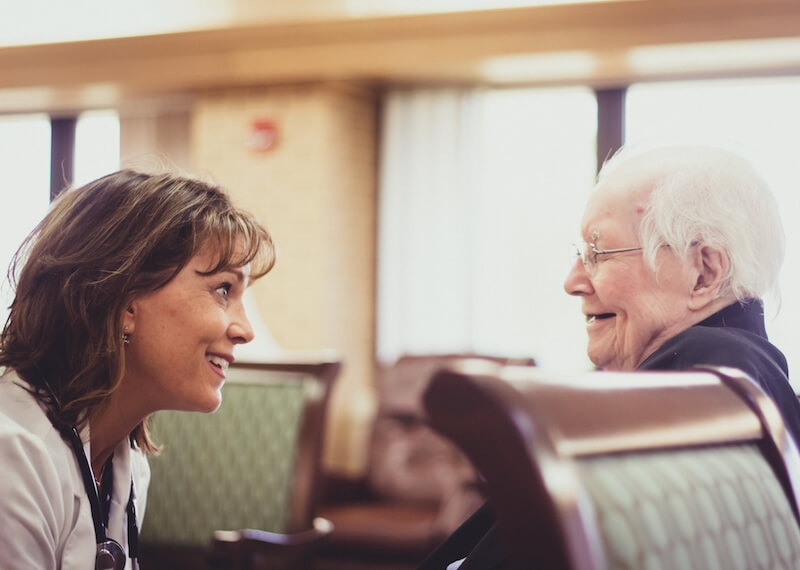 Amy Siple laughing with patient