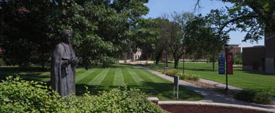 Landscape outside of Sacred Heart with the Cardinal Newman statue