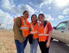 (From left to right) Sophie Johnston, Ashley Dinh and Britney Ma help clean the highway in Manhattan, Kansas, as part of the Circle K International conference.