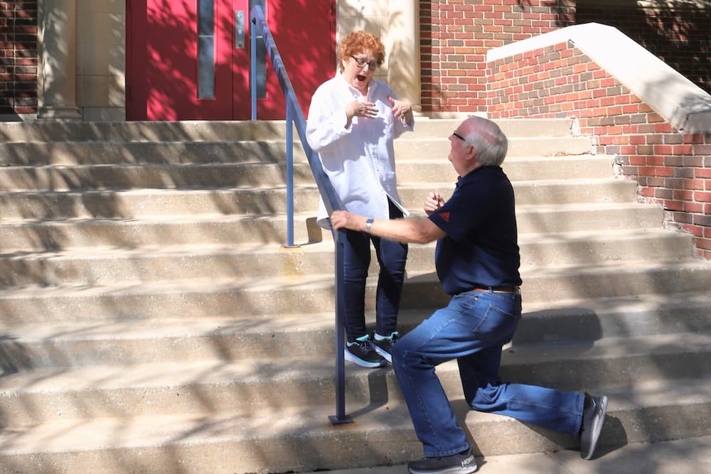 Kirk recreates the moment he proposed to Maribeth on the steps of Sacred Heart Hall on Aug. 20, 1978.