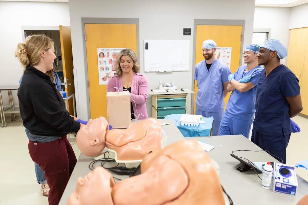 Associate Professor/Director of the Nurse Anesthesia Program Megan Cook instructs students in the classroom.