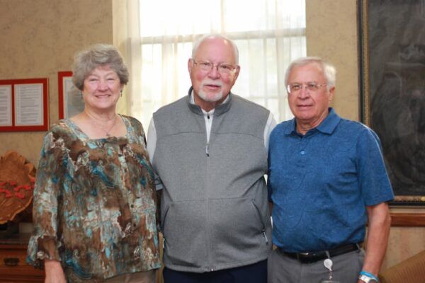 (From left to right) Marie and Bob Pearce with Father Tom Welk.
