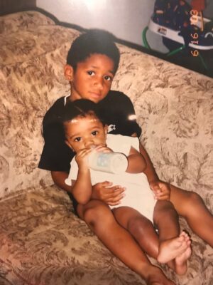 Derrick Isaiah Joe holds brother Jacob Joe (Courtesy photo)
