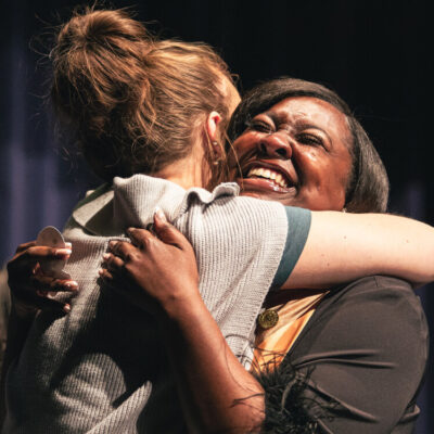 Nursing Pinning Ceremony Women hug.