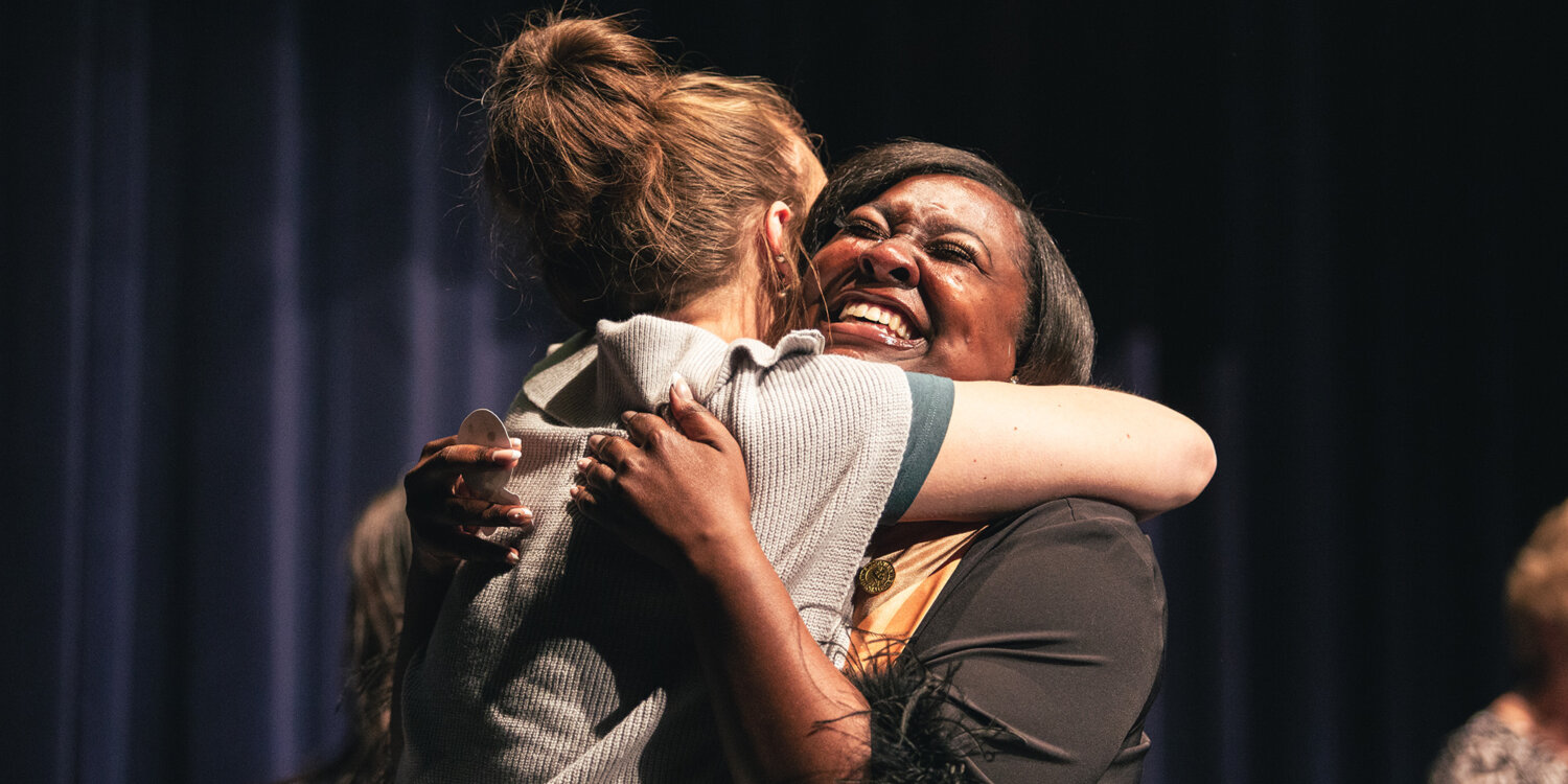 Nursing Pinning Ceremony Women hug.