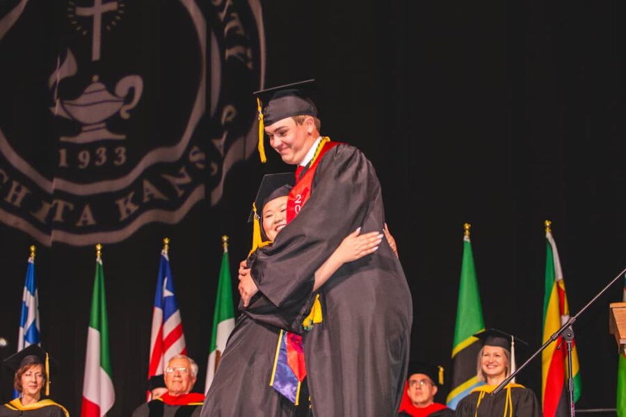 Dinh and Dessenberger embrace in a hug after being called to the stage.