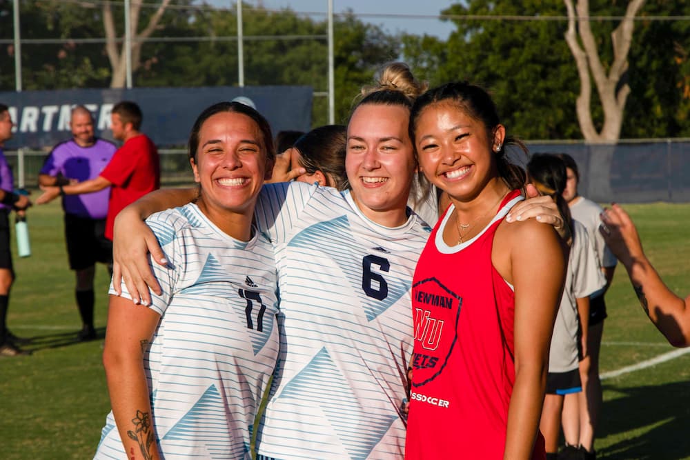 Members of the women's soccer team pose for a photo.