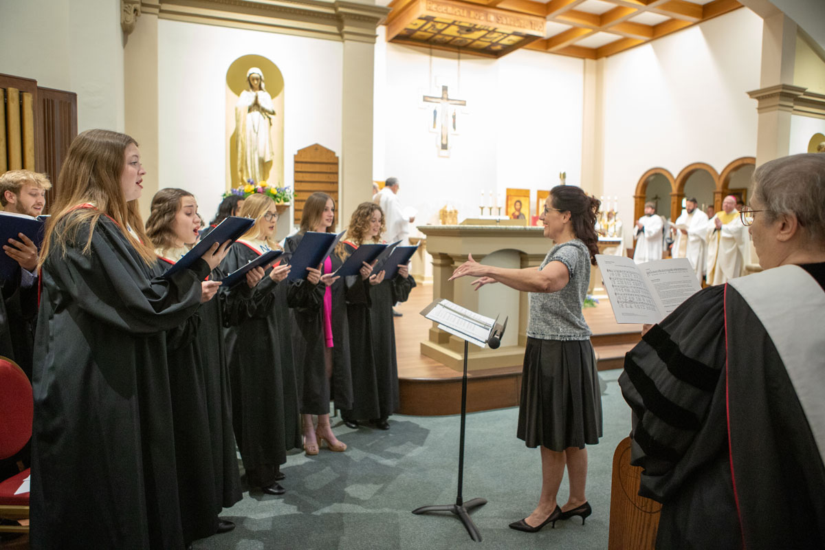 Deanne Zogleman directs Newman University choir.